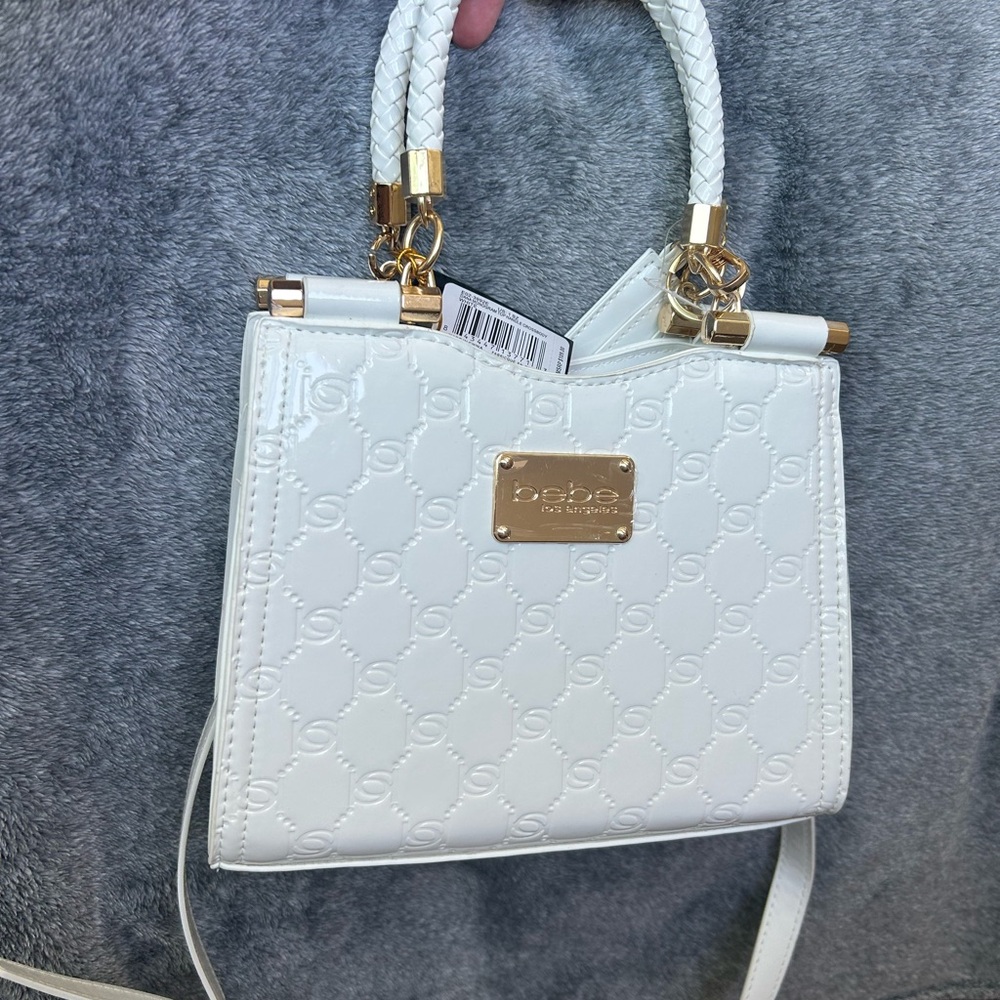 Never used Bebe Embossed White Mini Bag with Gold Details